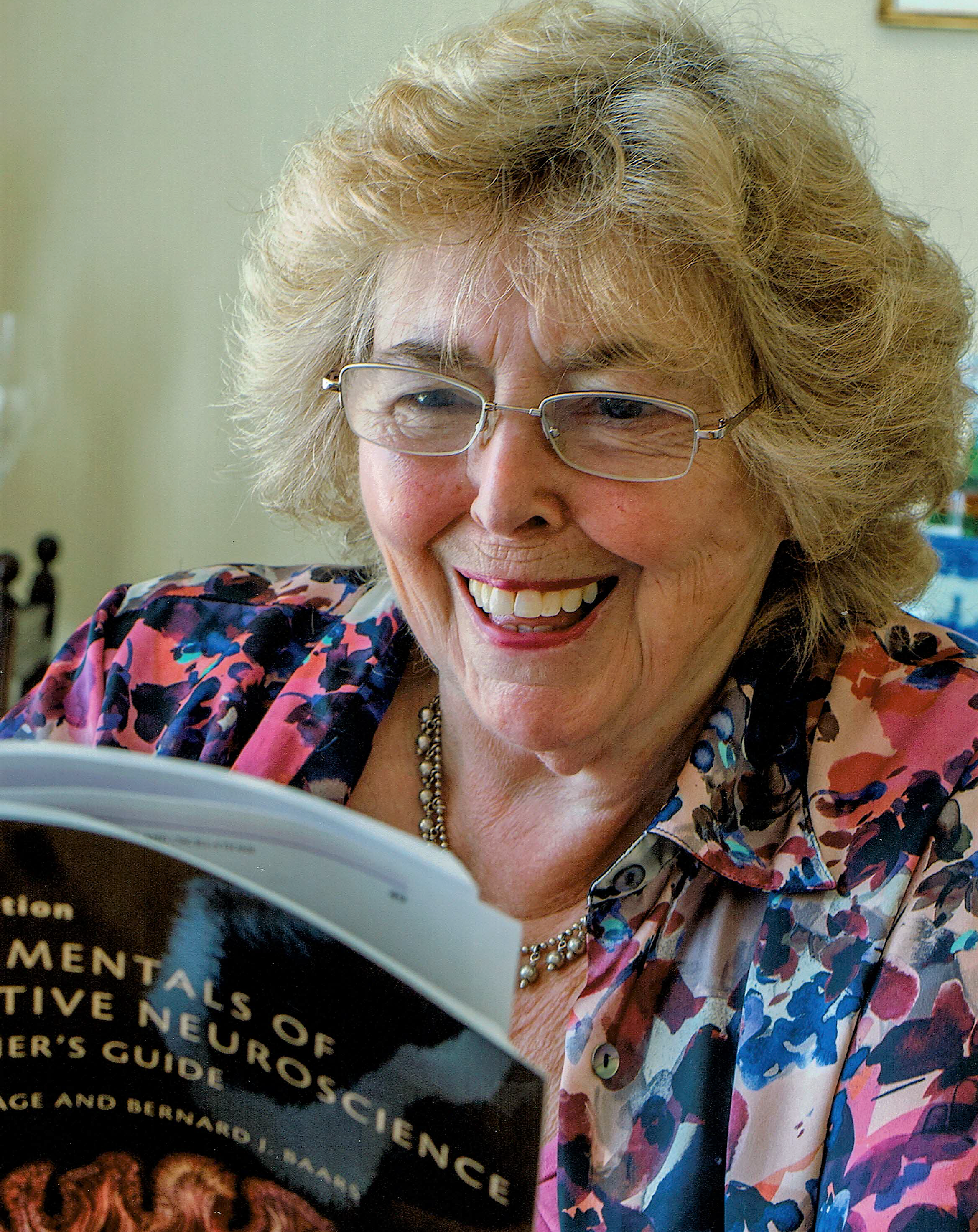 Photo of Brenda reading a Neuroscience Textbook