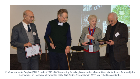 Professor Annette Dolphin (BNA President 2019 - 2021) awarding founding BNA members Robert Balazs (left), Steven Rose and John Lagnado (right) Honorary Membership at the BNA Festive Symposium in 2017.
