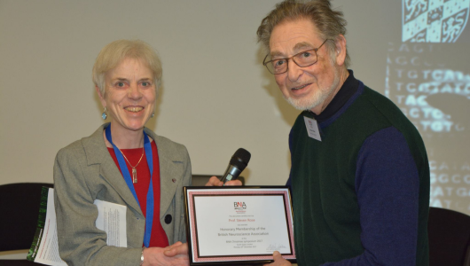 Professor Annette Dolphin awarding founding BNA member Professor Steven Rose with Honorary Membership at the BNA Festive Symposium in 2017. Image by Duncan Banks.
