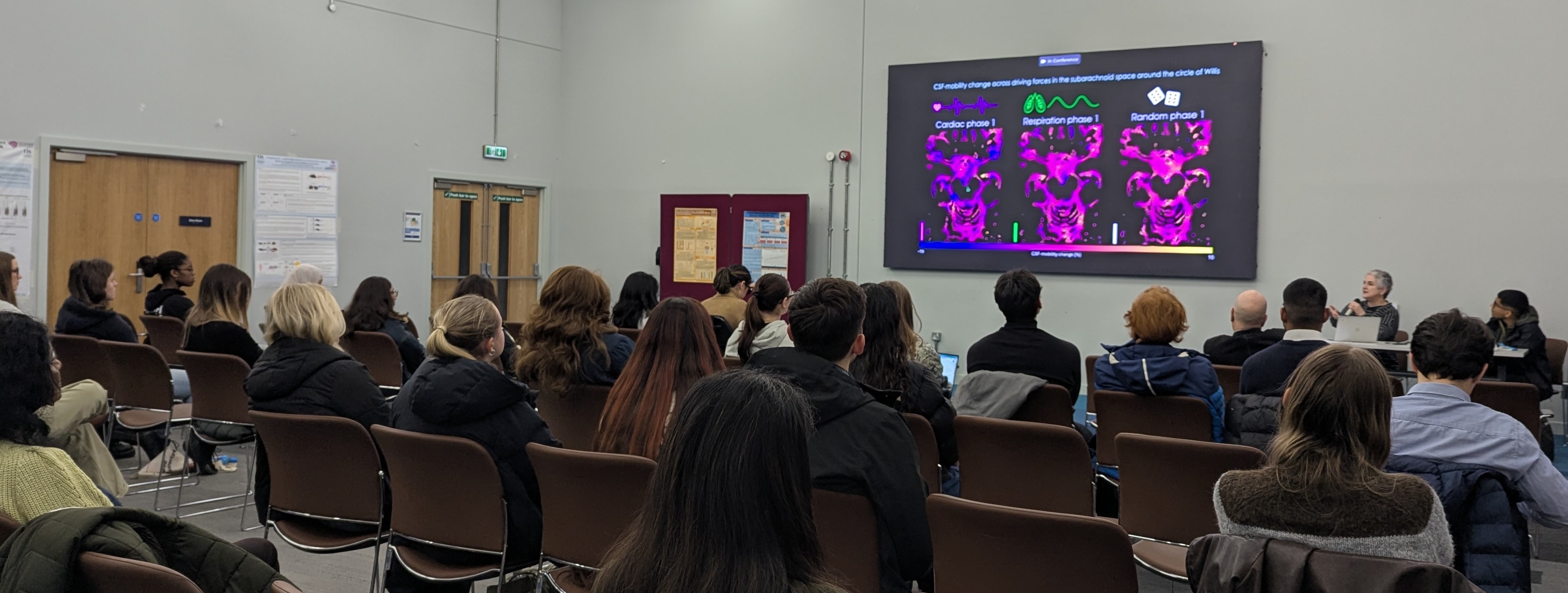 Attendees listen attentively to a presentation at the 2026 NeuroNurture mini-conference